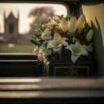 Hollywood Icon Passes Suddenly – Family SHUTS DOWN Rumor White flowers in a car with blurred background.