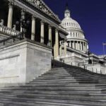 United States Capitol building with grand staircase and dome