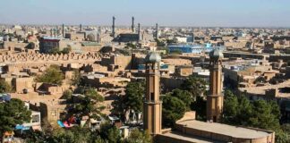 Aerial view of a city featuring traditional buildings and minarets