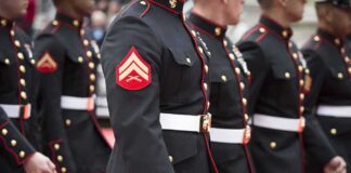 Marines in formal uniforms marching in a parade