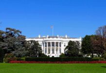 Soros Backed DA Threatens to BLOW UP White House The White House facade with flag and gardens