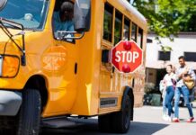 Furious Parents Smash Their Way Into School Bus To RESCUE Kids School bus with extended stop sign near students on sidewalk