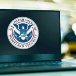 TERROR-Supporting Sister UPENDS Senate Race Laptop displaying U.S. Department of Homeland Security logo.