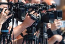 Tsunami Alerts BLARE After Killer Quake Strikes! television cameras on tripods at a media event