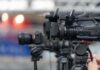 Professional video cameras on tripods