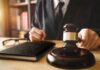 Migrant Assisting Judge Walks SCOT-FREE Judge with gavel striking sound block
