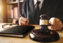 Migrant Assisting Judge Walks SCOT-FREE Judge with gavel striking sound block