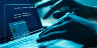 Hands typing on a laptop with cybersecurity login overlay