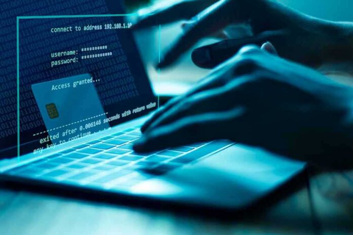 Hands typing on a laptop with cybersecurity login overlay