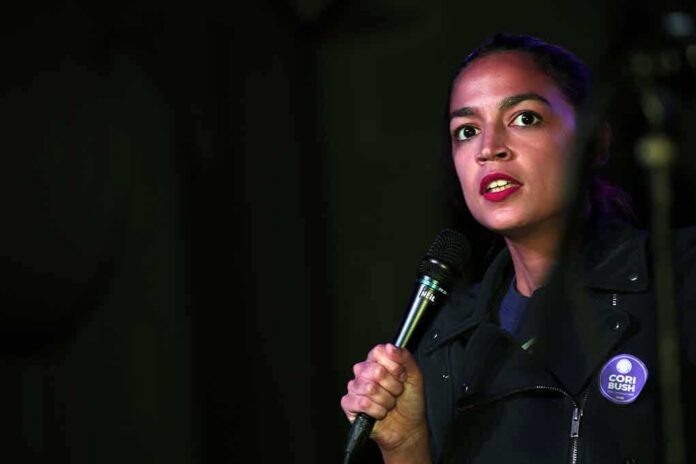 Woman speaking into a microphone on stage