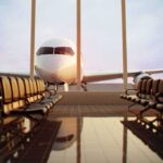 Plane Plunges 18,000 Feet After Cockpit Stabbing in Suspected Terror Attack Airplane seen through terminal windows with empty gate seating