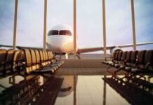 Plane Plunges 18,000 Feet After Cockpit Stabbing in Suspected Terror Attack Airplane seen through terminal windows with empty gate seating