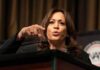 Kamala Teams Up With Radical Candidate in Sign of Intent Woman speaking at a podium and gesturing with her hand