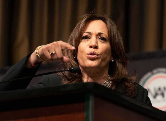 Woman speaking at a podium and gesturing with her hand