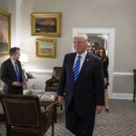 Trump Issues Protocol Should He Be Killed Donald Trump walks through an office with Sean Lawler nearby and Mariano Rajoy following behind