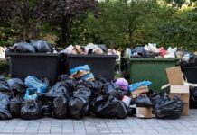 Mother Pleads Guilty – Killed Newborn in Dumpster Overflowing dumpsters with piles of trash bags and cardboard