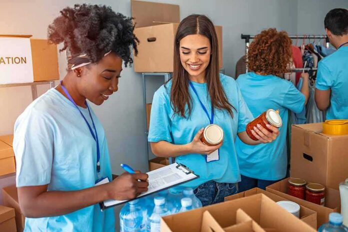 Volunteers sorting food donations in a community center