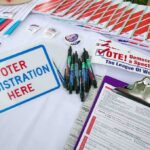 Muslim Candidate Declares He Will Follow Sharia in EVERYTHING He Does Voter registration table with forms, pens, and informational materials