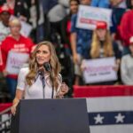 Hegseth’s Transphobic Slur Has Liberals FUMING! Walter Jones speaks at a rally podium with a crowd and flags in the background