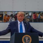 Trump Chooses His Successor – 2028 Race Begins Donald Trump speaks at a podium with arms outstretched