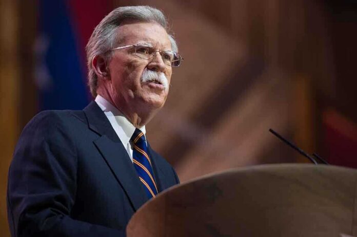 John R. Bolton speaking at a podium