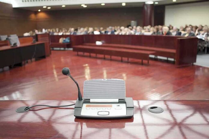 shutterstock_184839521-3 Conference microphone on a podium in a courtroom