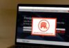 GOP Meeting Turns Into Shouting Match: ‘This Is F***ing War!’ Laptop screen showing a political committee website with a popup featuring an elephant logo
