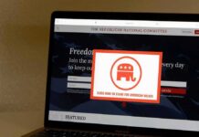 Laptop screen showing a political committee website with a popup featuring an elephant logo