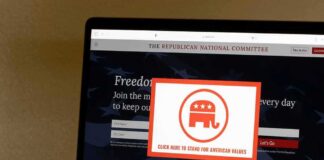 Laptop screen showing a political committee website with a popup featuring an elephant logo