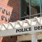 Man ARRESTED – Catholic Church Attack Thwarted! Police department entrance with pergola and brick wall