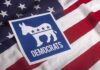 Wacky Dem Nominee Writes Song Hoping Senator Would Die Democratic Party donkey symbol on American flag