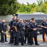 Group of police officers standing in a parking lot