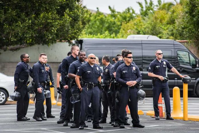 Group of police officers standing in a parking lot