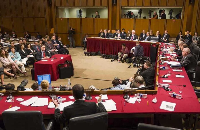 shutterstock_387761506 Patrick Leahy and Samuel Alito at a Senate hearing with committee and press present