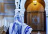 El-Sayed’s Lesbian Rosh Hashanah Stunt BACKFIRES Spectacularly Person in white and blue prayer shawl facing ornate interior