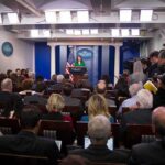 Omarosa Manigault, Jonathan Cyprien, and Jon Ledecky in a crowded White House press briefing