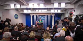 Omarosa Manigault, Jonathan Cyprien, and Jon Ledecky in a crowded White House press briefing
