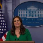 woman speaking at a White House press briefing podium