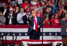Boxing Legend Shocks Trump Rally Donald Trump points from a rally stage; Rudi Koertzen and Bear Pascoe are in the crowd