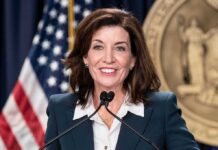 Governors Goal: “Get as Many Illegals Into City As Possible!” woman speaking at a podium with microphones