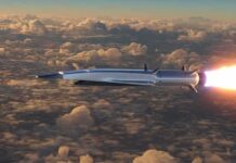 Air Force Launches Its First Hypersonic Weapon into Production Hypersonic missile flying above clouds with bright exhaust flame