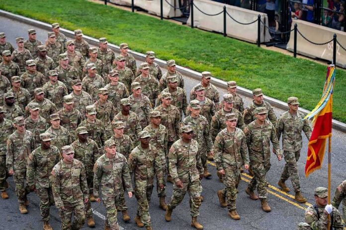 Soldiers in camouflage uniforms march in formation on a street