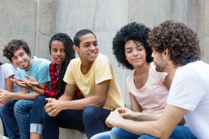 African,American,And,Latin,Young,Adults,Talking,About,Politics,Outdoor