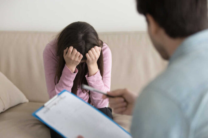 Young,Woman,At,The,Psychologist,,Feeling,Hopeless,And,Depressed,,Crying