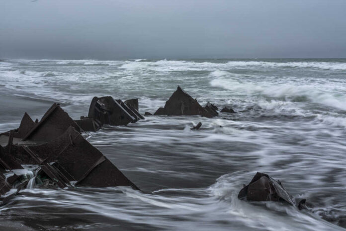 Waves,Wash,The,Wreckage,Of,The,Ship,On,The,Seashore