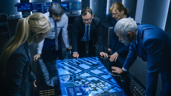 High,Angle,Shot,Of,Team,Of,Government,Intelligence,Agents,Talking