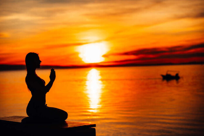 Carefree,Calm,Woman,Meditating,In,Nature.finding,Inner,Peace.yoga,Practice.spiritual,Healing